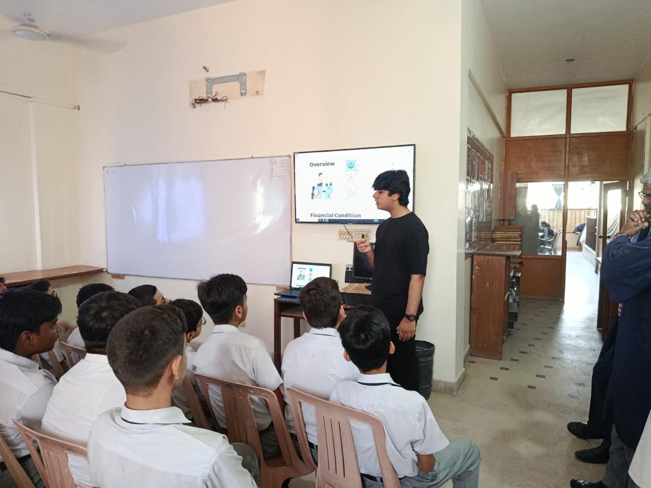 A teacher guiding students